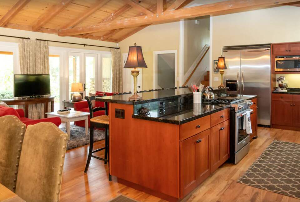 Open kitchen with eat-in bar for six