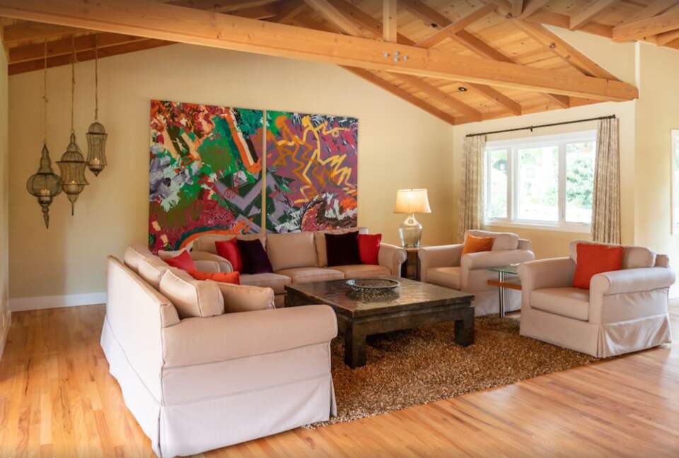 Living room with vaulted ceiling and exposed beams