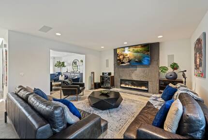 Modern, open living room with fireplace