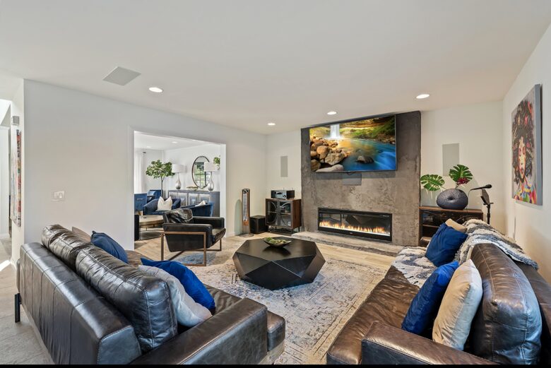 Modern, open living room with fireplace