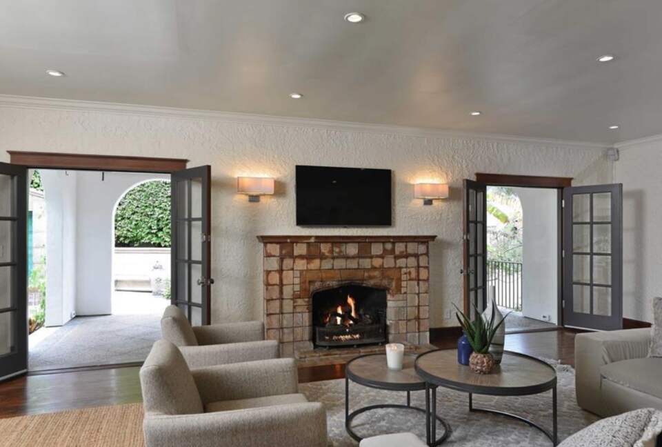 Living room with fireplace and double French doors