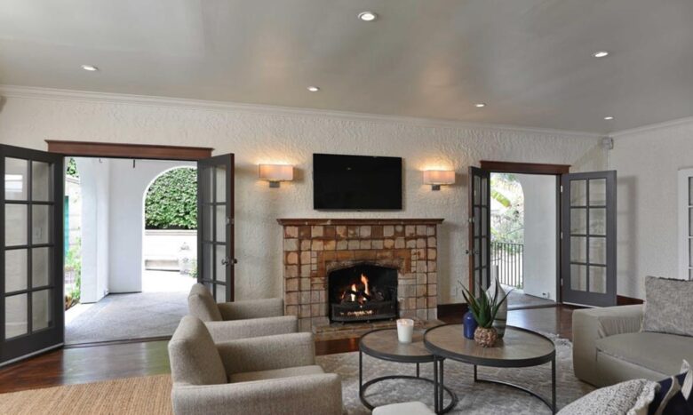 Living room with fireplace and double French doors
