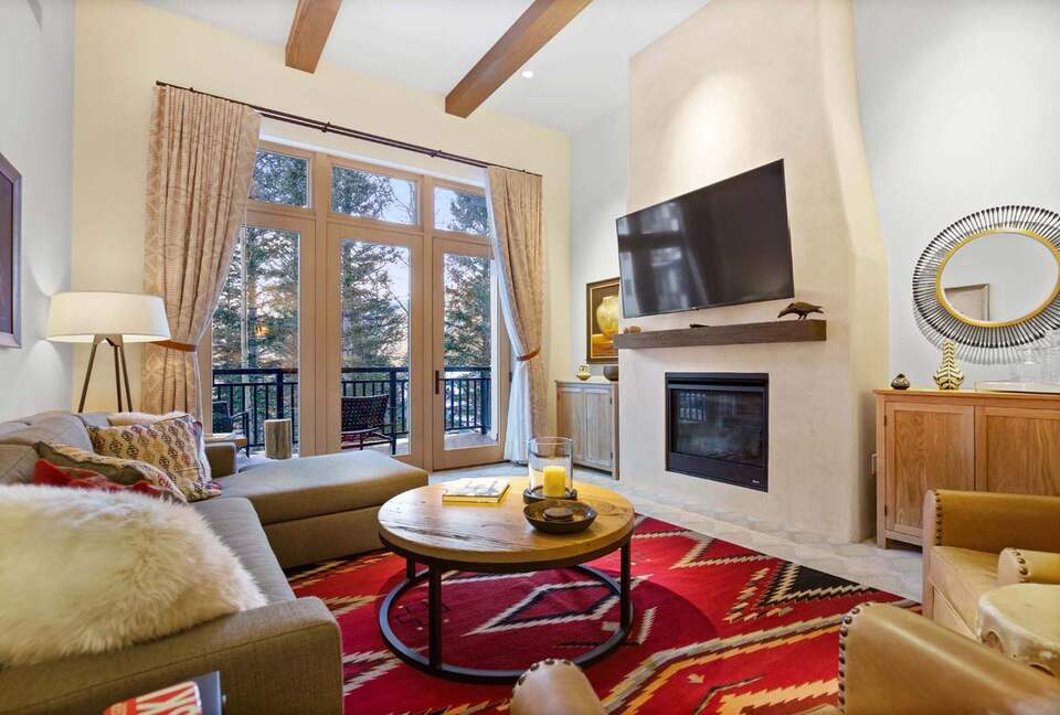 Home Exchange Taos Ski Valley, NM fireplace with high ceilings