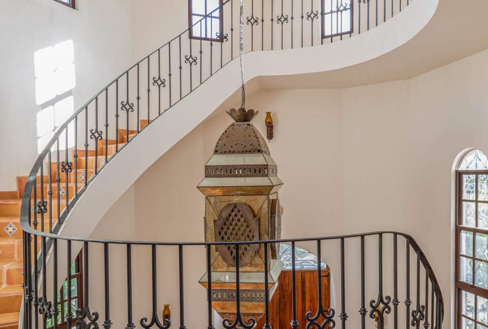 Home Exchange in Tulum, Mexico spiral staircase with detailed light