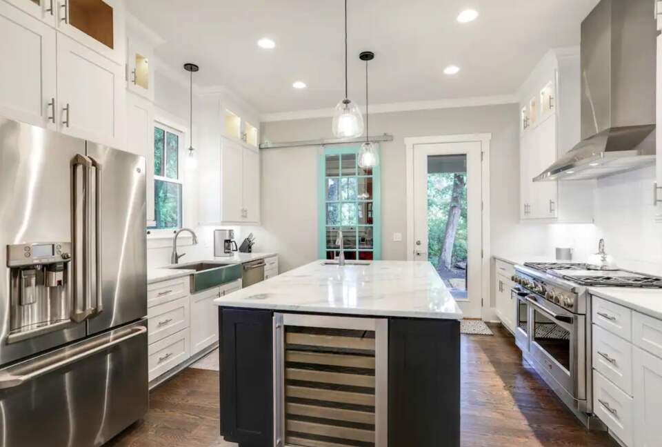 Chef's kitchen with granite countertops and large island