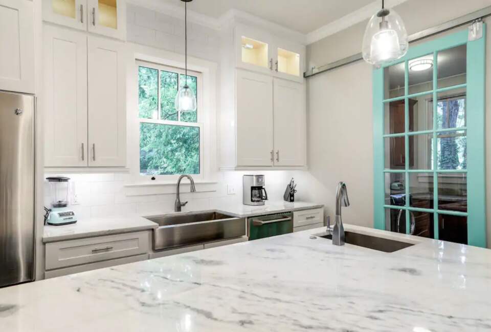 Chef's kitchen with granite countertops and large island