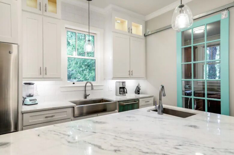 Chef's kitchen with granite countertops and large island