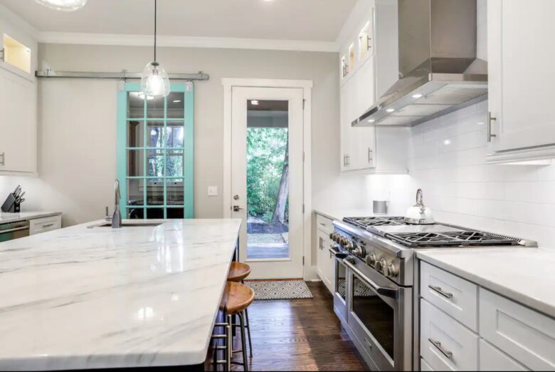 Chef's kitchen with granite countertops and large island