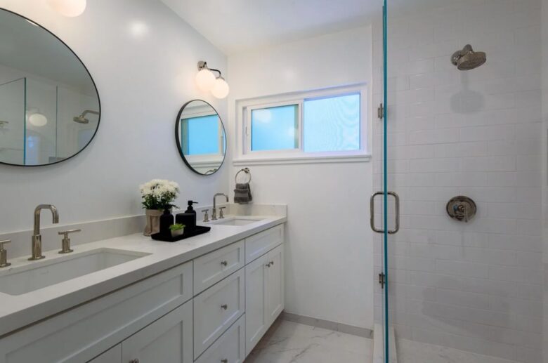 Master bathroom with double vanities and walk-in shower