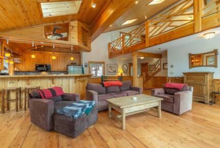 Home Exchange in Truckee, CA, living room with high ceilings and loft