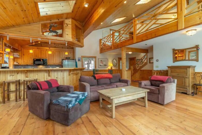 Home Exchange in Truckee, CA, living room with high ceilings and loft