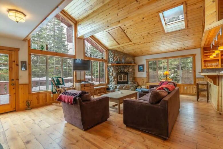 Home Exchange in Truckee, CA, living room with wall to wall windows