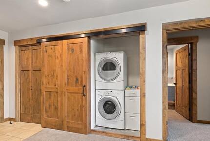 Home Exchange in Cle Elum, WA, barn doors open to laundry closet