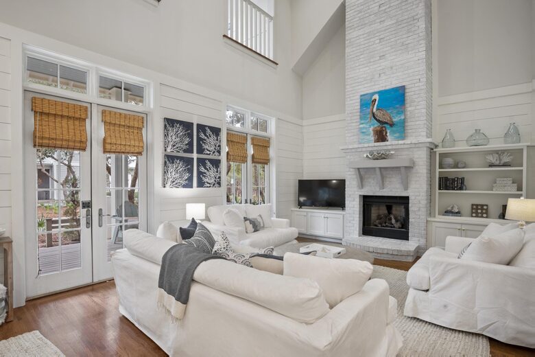 Open living room with two-story fireplace