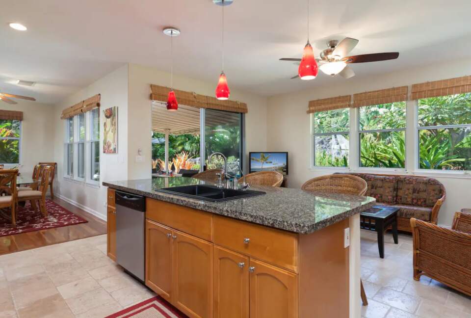 Kitchen with island open to living