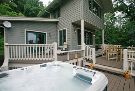 Home Exchange in Fairview, NC, back patio with lounge and hot tub