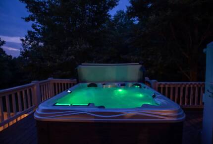 Home Exchange in Fairview, NC, hot tub at night