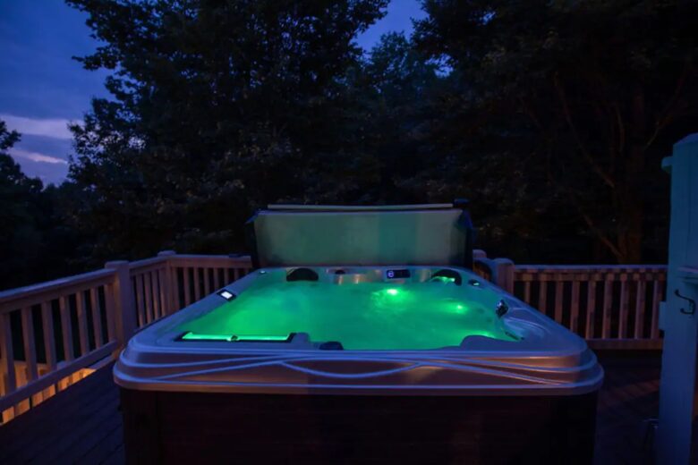 Home Exchange in Fairview, NC, hot tub at night