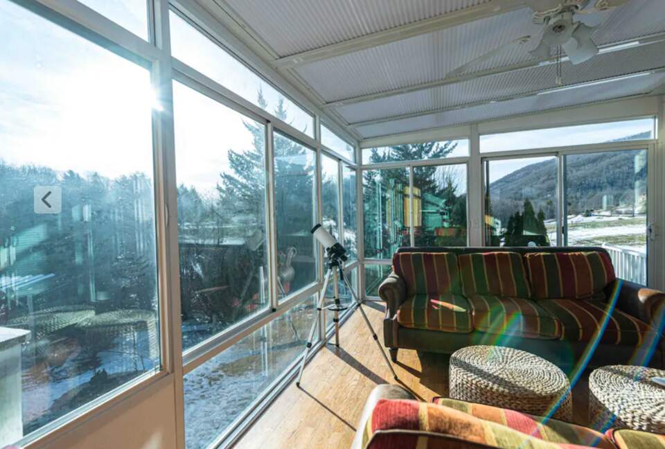 Sunroom with telescope