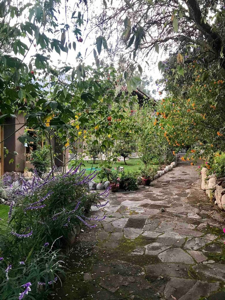 Home Exchange in Urubamba, Cusco, Peru, garden with stone path