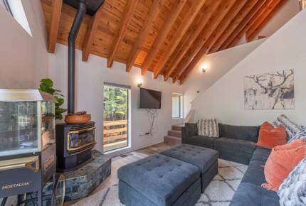 Home Exchange in Tahoma, CA, great room with fireplace and television