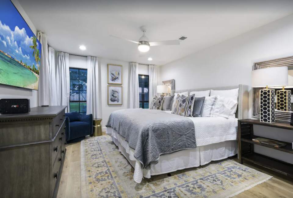 Spacious master bedroom with flat screen TV