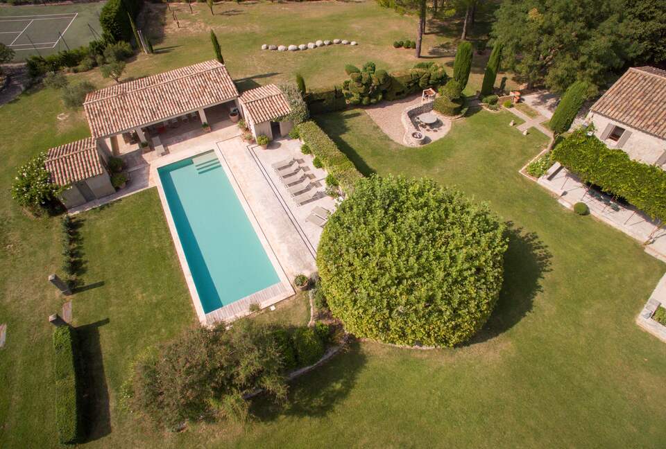 The swimming pool and pool house seen from above