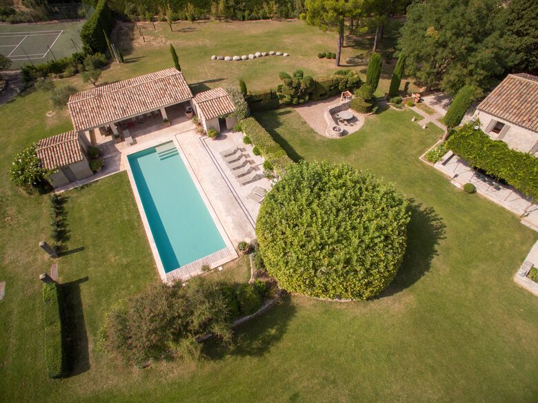 The swimming pool and pool house seen from above