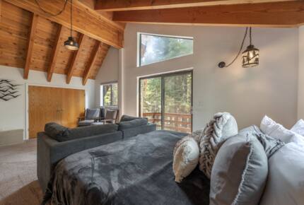 Home Exchange in Tahoma, CA, master bedroom with balcony and king bed