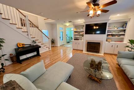 Home Exchange in Virginia Beach, VA family room with fireplace and TV