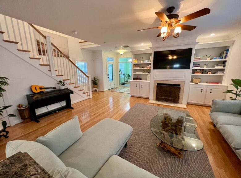 Home Exchange in Virginia Beach, VA family room with fireplace and TV