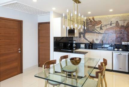 Home exchange in Los Cabos at Garza Blanca Resort, glass dining table