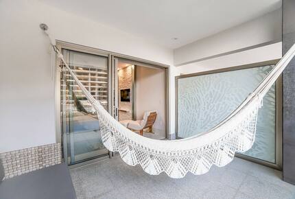 Home exchange in Los Cabos at Garza Blanca Resort, balcony hammock