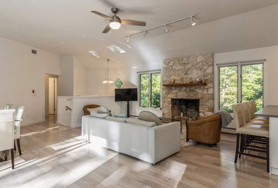 Home Exchange in Sag Harbor, NY family room with stone fireplace