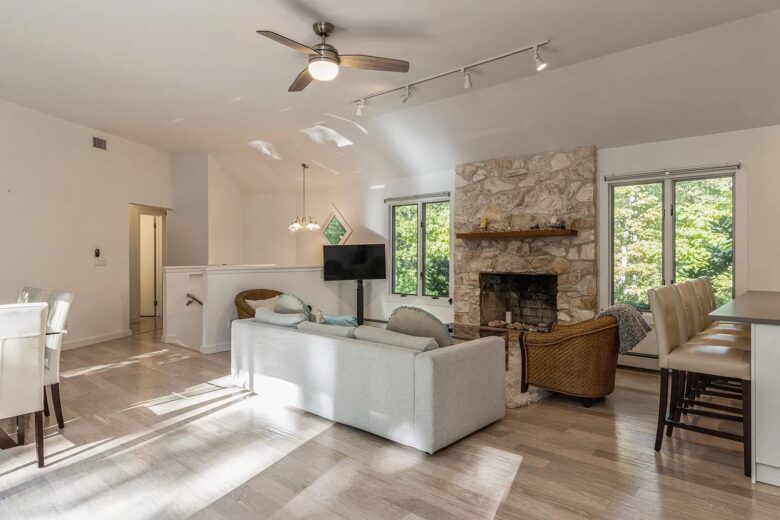 Home Exchange in Sag Harbor, NY family room with stone fireplace