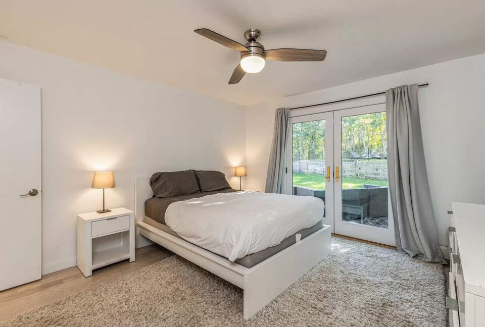 Home Exchange in Sag Harbor, NY master suite with deck access