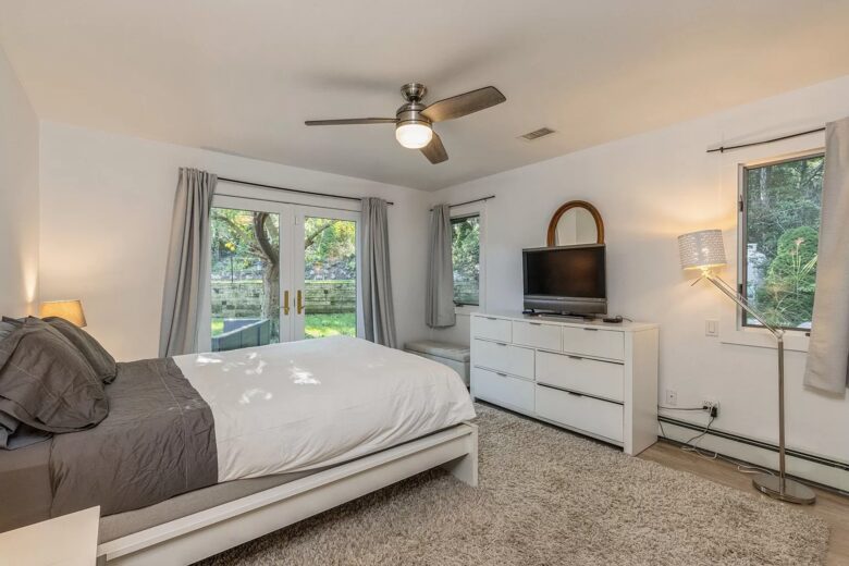 Home Exchange in Sag Harbor, NY master suite with television