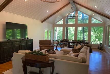 Home Exchange in Winchester, TN family room with wood beam ceilings
