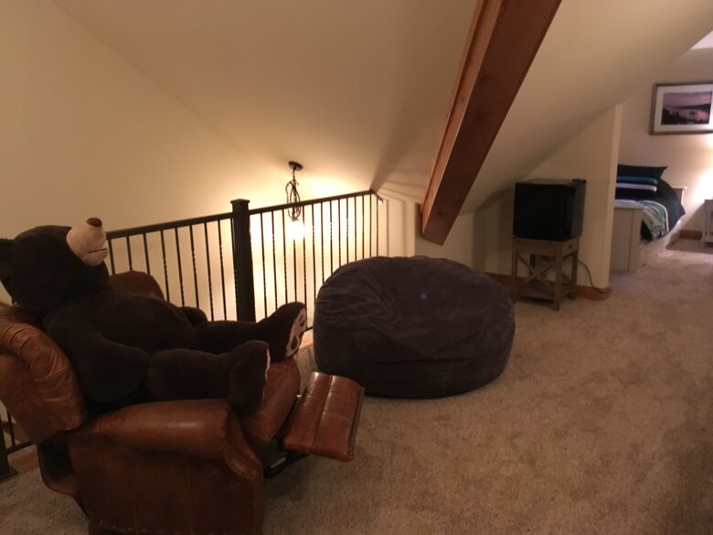 3rd floor game room, twin beds at far end.