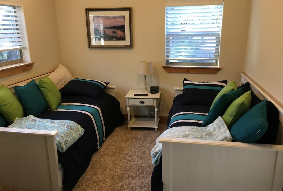 twin beds at far end of game room.