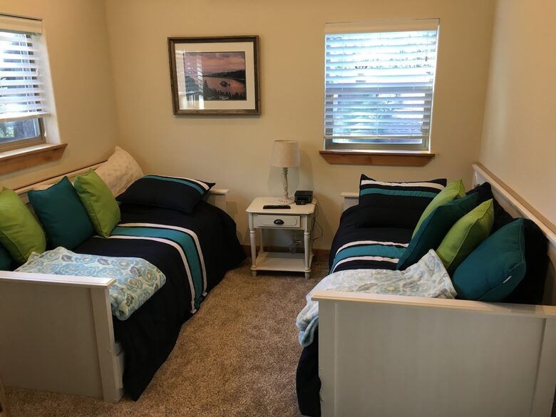 twin beds at far end of game room.