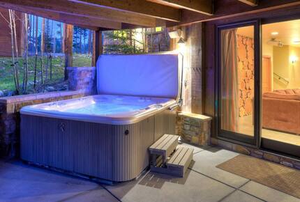 Home Exchange in Breckenridge, CO lower patio with hot tub