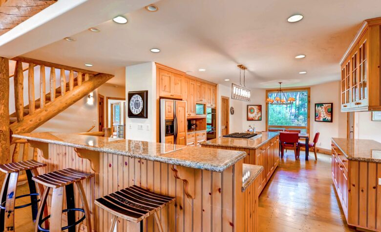 Chef's kitchen with eat-in bar for three