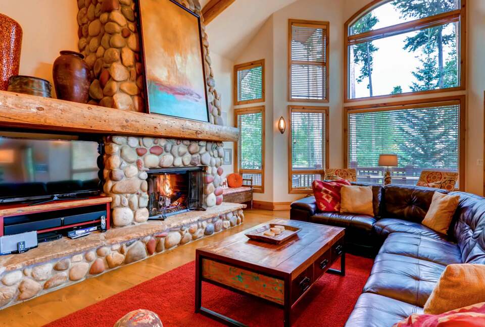 Open living room with forest views
