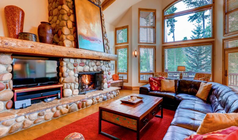 Open living room with forest views