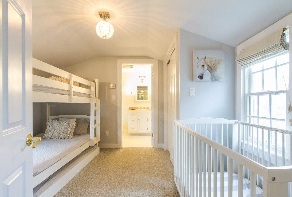 Bedroom off of master has bunk beds, full size crib and a twin trundle