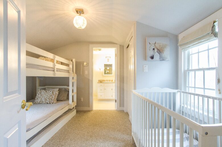Bedroom off of master has bunk beds, full size crib and a twin trundle