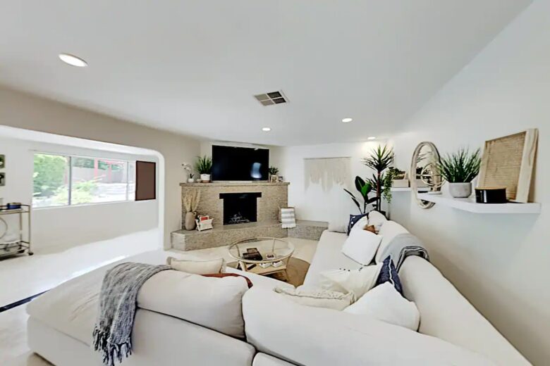 Home Exchange in Palm Springs, CA fireplace and television in living