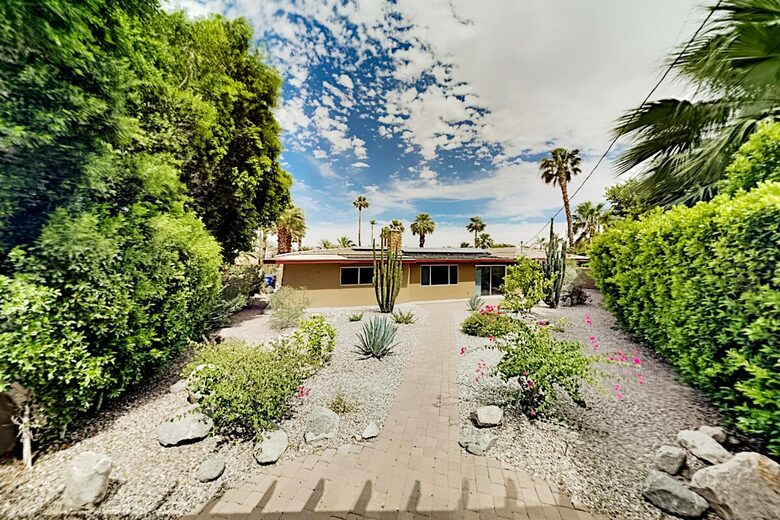 Home Exchange in Palm Springs, CA desert yard with blue skies