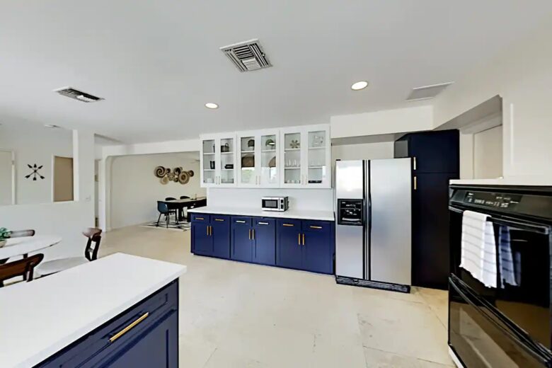 Home Exchange in Palm Springs, CA modern kitchen with glass cabinets